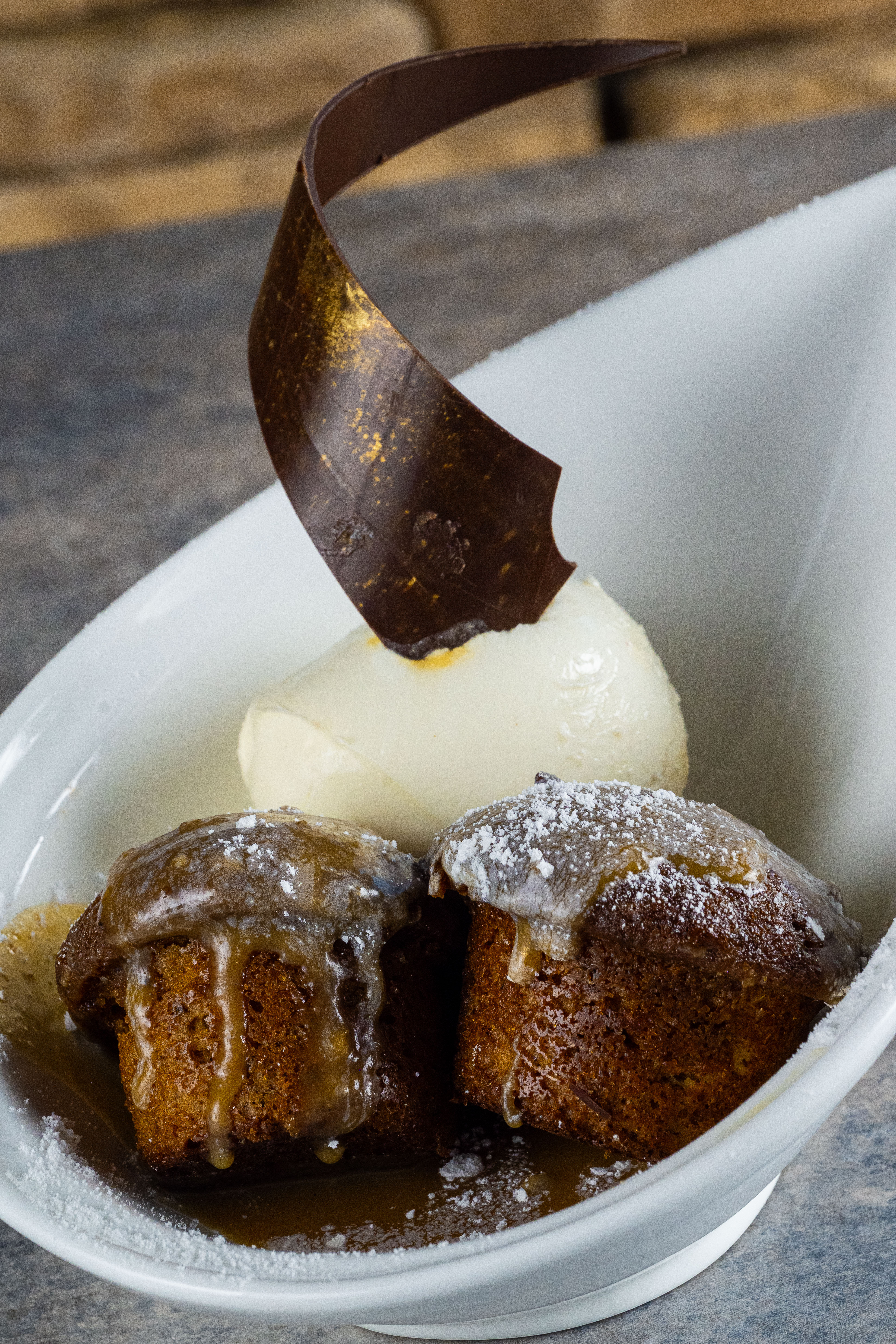 Sticky Date Toffee Pudding
Warm date cake finished with buttery toffee sauce and served with creamy vanilla ice cream.