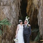 Bride and groom on golf course landscape