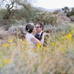 bride and groom amongst flowers