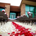 Wedding aisle with red and white flower petals
