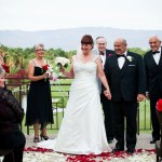 Bride and groom just married with red petals