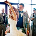 Groom spinning bride during first dance