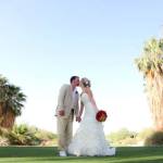 bride and groom kissing on golf course