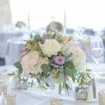 Light pastel flower centerpiece on banquet table 
