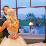 Bride and groom during slow dance in ballroom