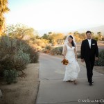 Bride and groom walking down the golf cart path