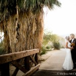 Bride and groom on wooden walkway