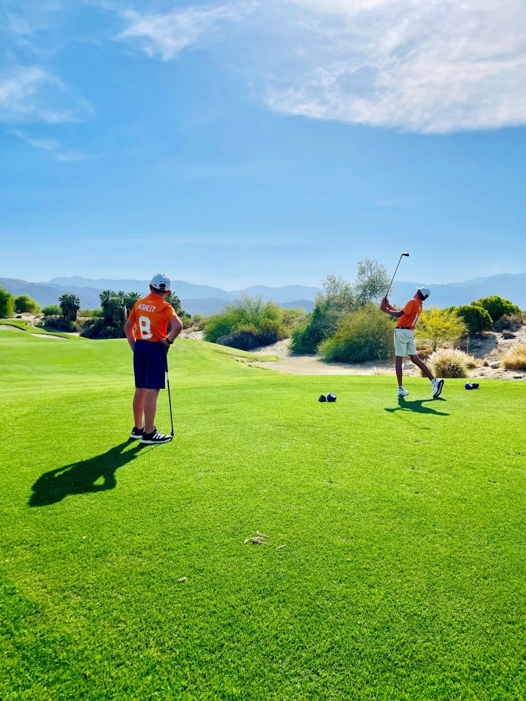 Junior golfers practicing at the Palm Desert Golf Academy at Desert Willow Golf Resort, receiving PGA Professional instruction on swing fundamentals.