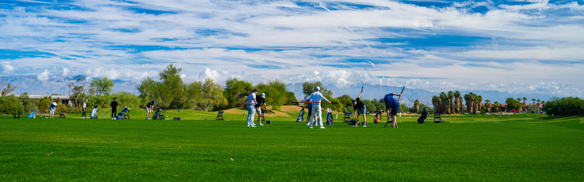 Golfers practicing Stick Mobility stretches on a sunny training tee to improve flexibility and rotational strength