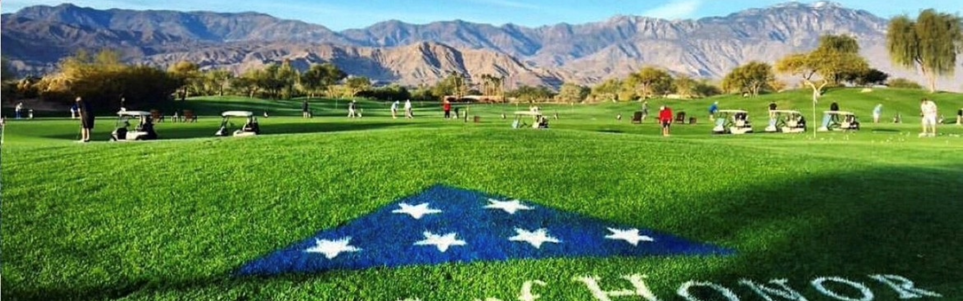 Folds of Honor logo painted on the practice facility at Desert Willow Golf Resort for fundraising event.